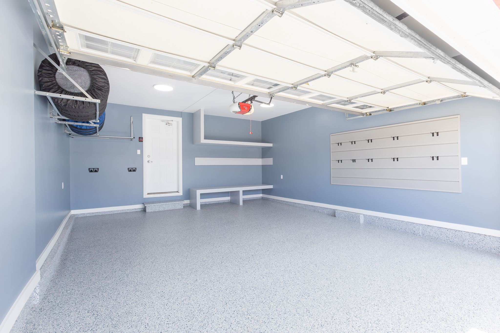 Overhead bike and tire storage with tool wall, Pinnacle Garage Works completed job