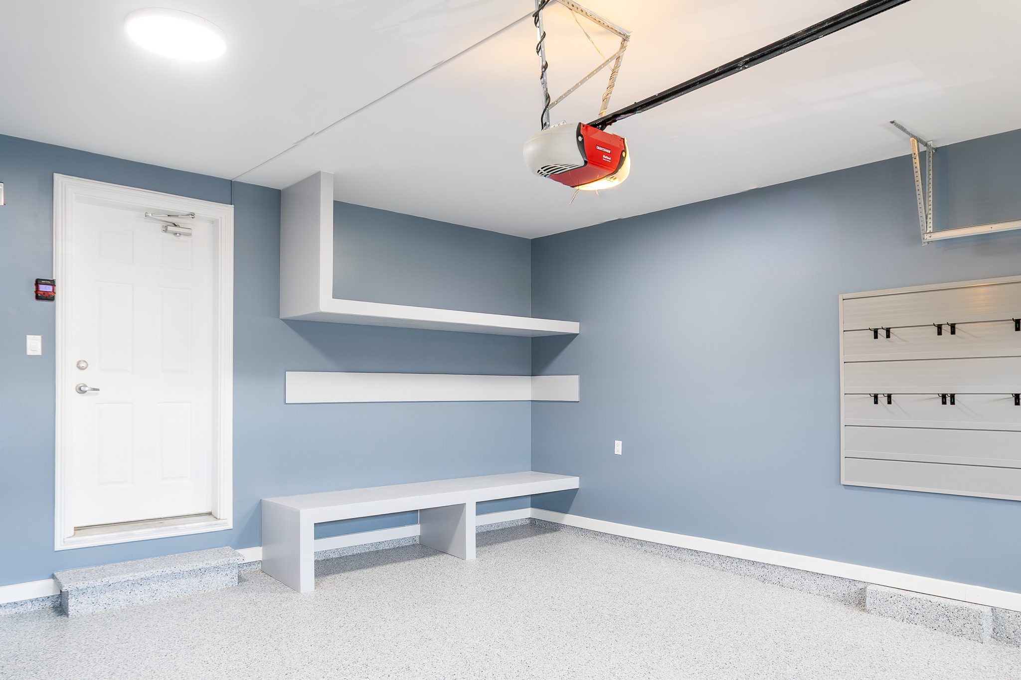Floating shelving, bench, and slatwall tool panel, Pinnacle Garage Works completed job