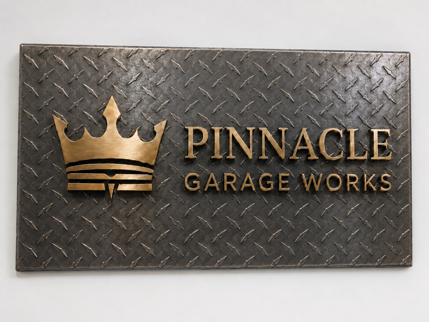 Diamond-plate metal sign with Pinnacle Garage Works logo